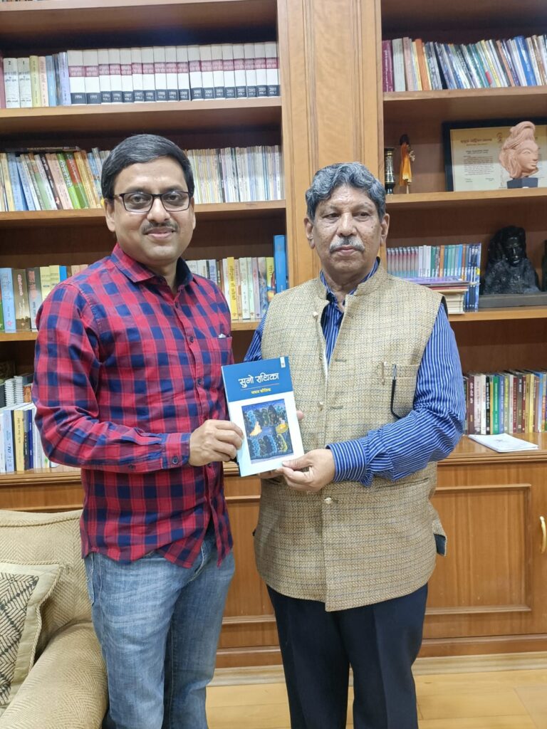 President, Sahitya Akademi, Mr Madhab Koushik presenting his book to Angshuman Kar